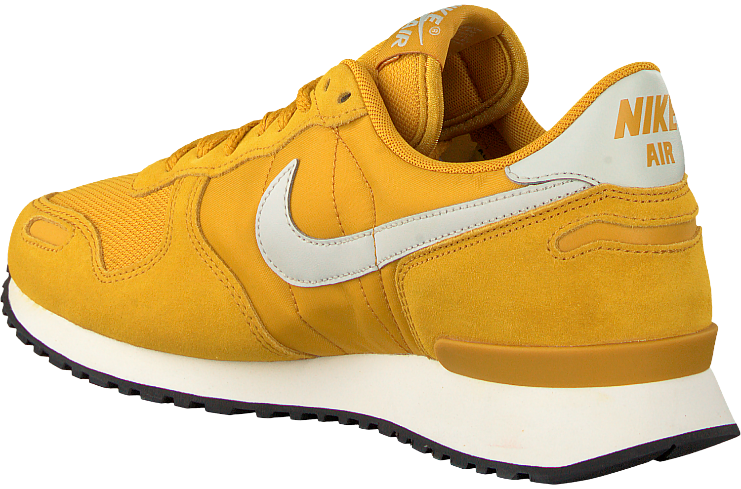 beige and black nike shoes