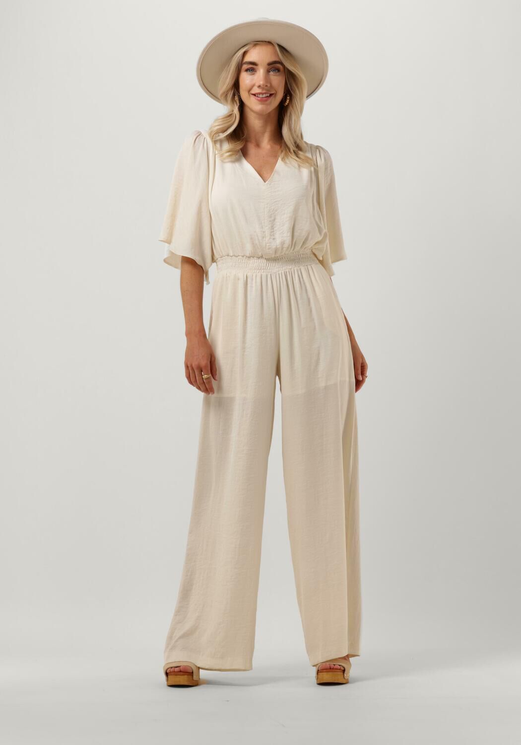 creme access jumpsuit jumpsuit with batwing sleeves