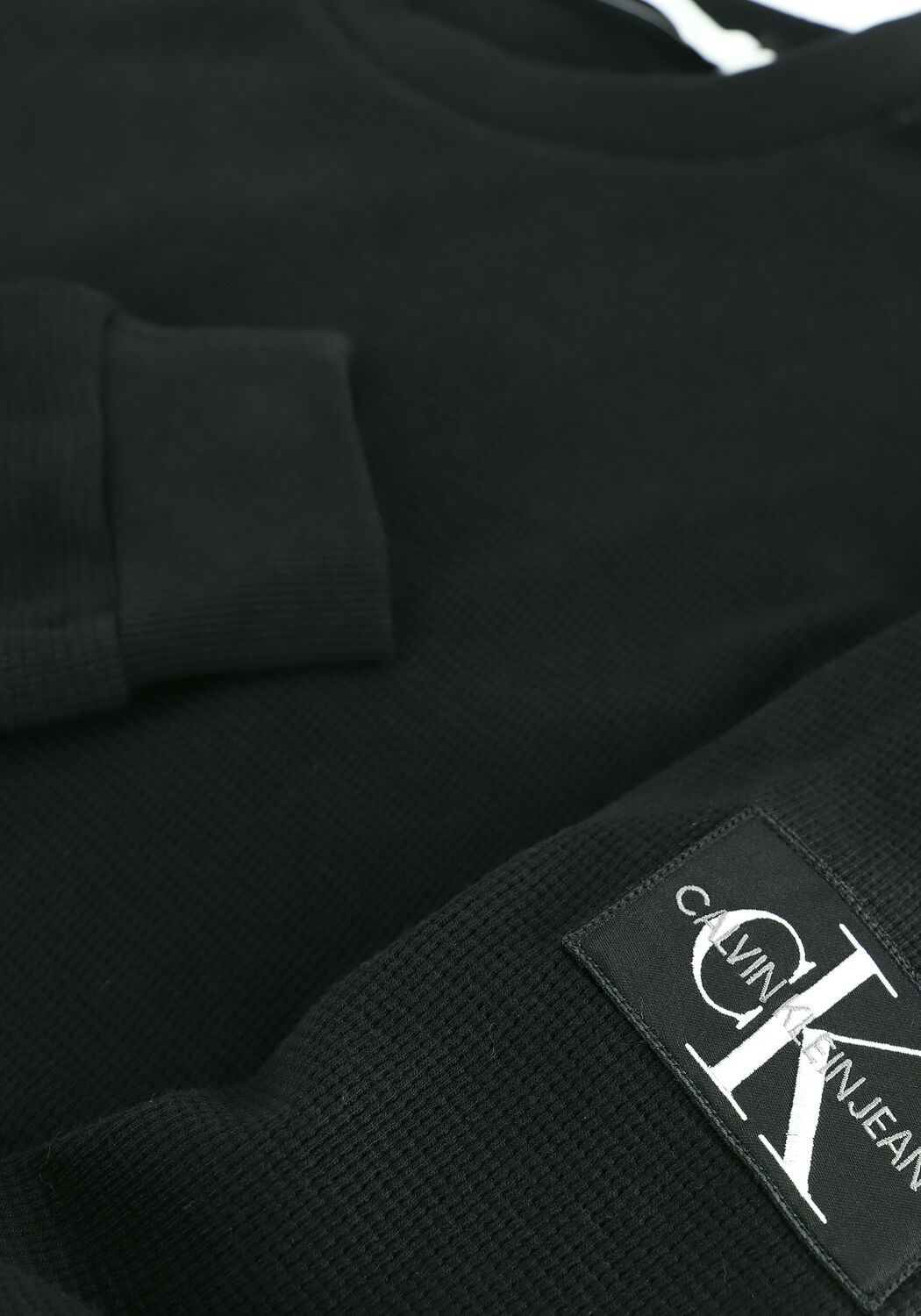 Schwarze CALVIN KLEIN Sweatshirt BADGE WAFFLE LS TEE - large